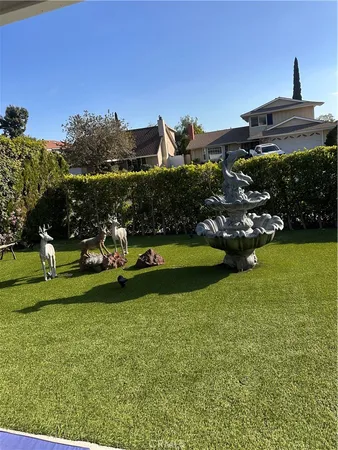 a view of a park with large trees