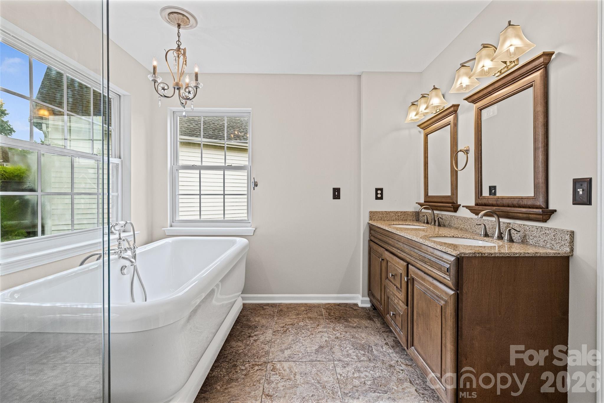 620 East Cheval Drive Fort Mill, SC 29708 - Photo 24 of 48 a bathroom with a tub sink and mirror