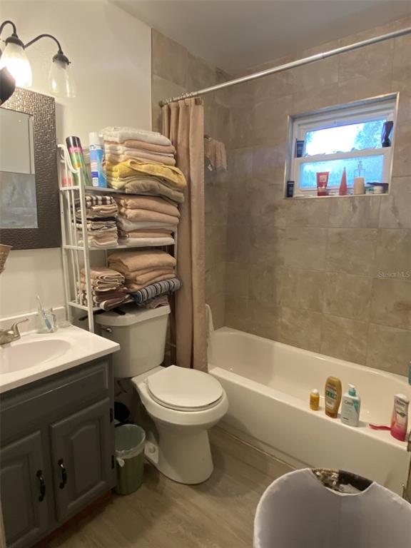 4472 Fairview Avenue Orlando, FL 32804 - Photo 14 of 18 a bathroom with a sink toilet and shower