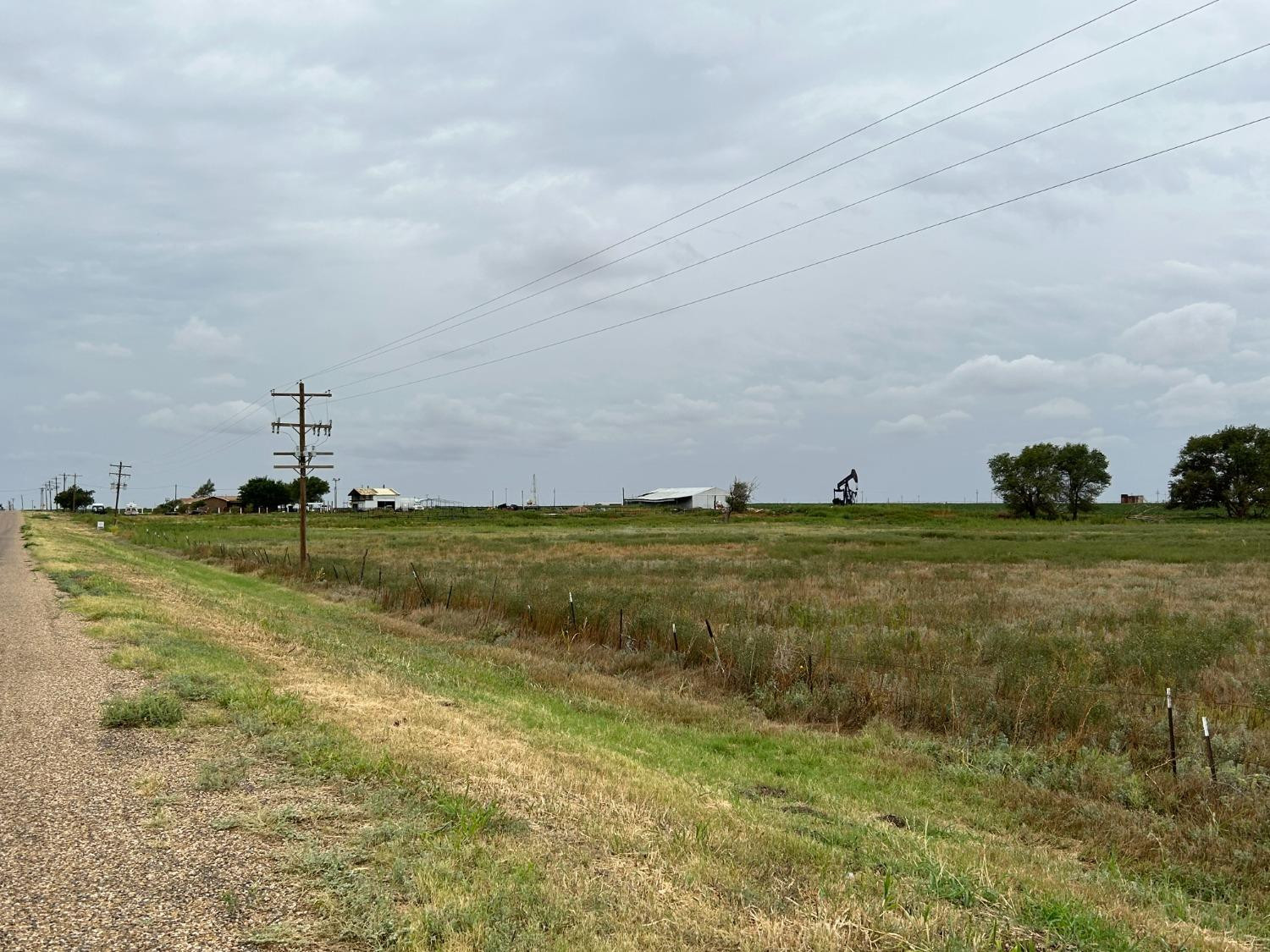 660 Justin Road Levelland, TX 79336 - Photo 2 of 5 a view of a field with an trees