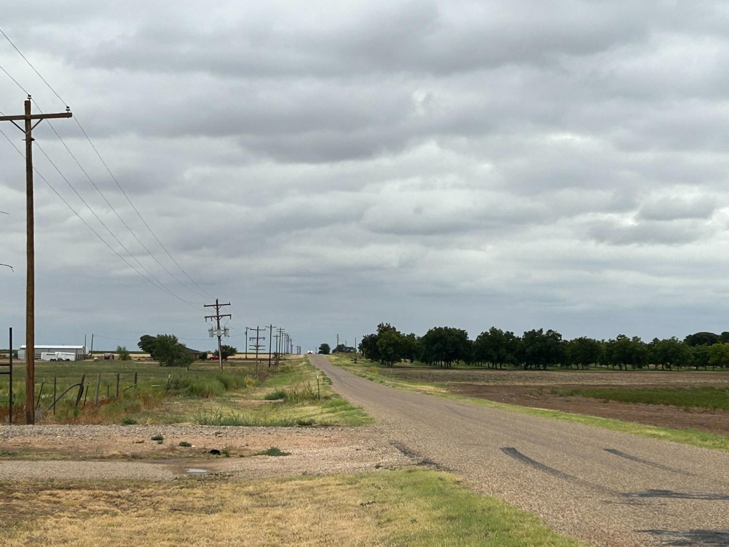 660 Justin Road Levelland, TX 79336 - Photo 4 of 5 a view of a lake from a yard