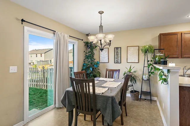 a view of a dining room with furniture window and outside view