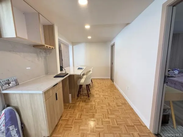 a view of a kitchen from the hallway
