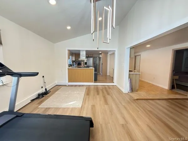 a view of a kitchen with a sink and cabinets