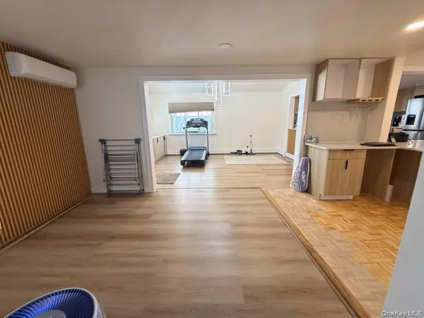 a view of kitchen with furniture and wooden floor