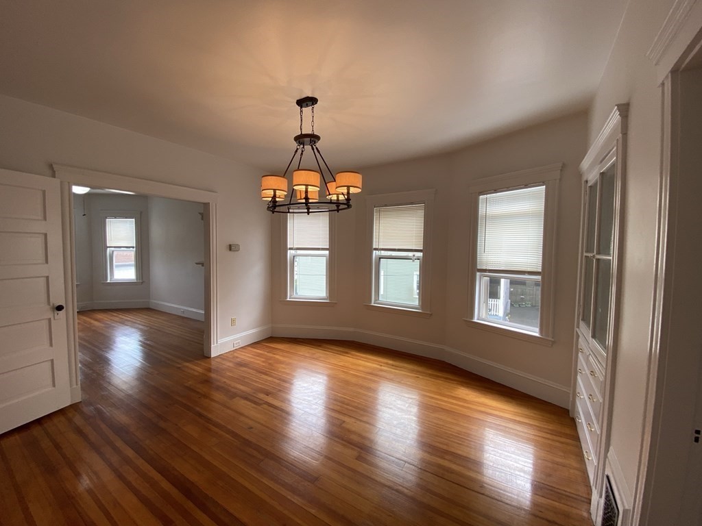a view of livingroom with hardwood floor and hallway
