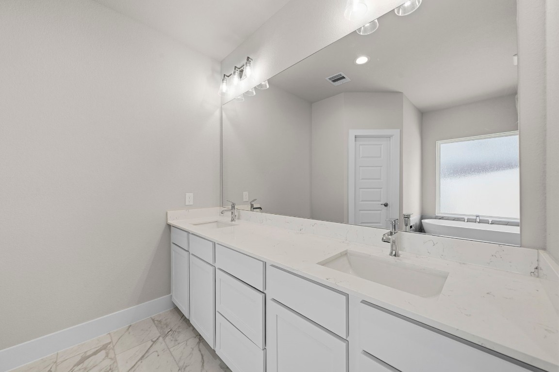2137 Golden Spruce Court Conroe, TX 77301 - Photo 15 of 41 a bathroom with a sink and a mirror