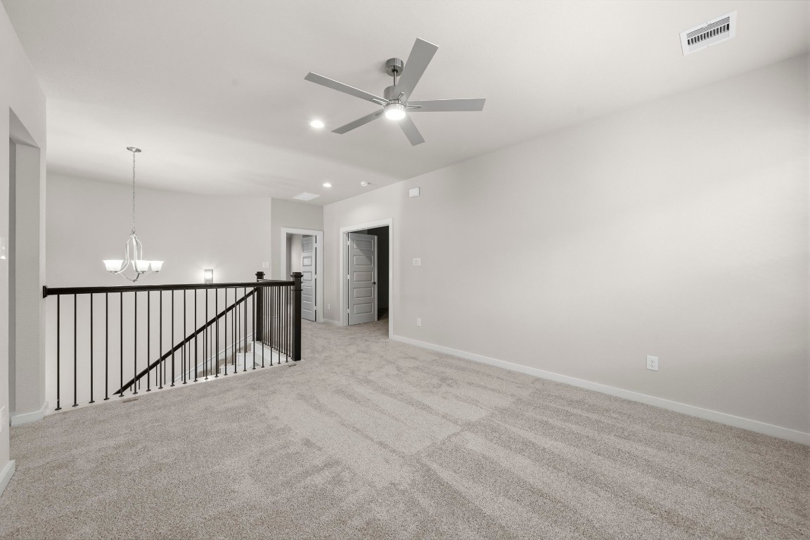 2137 Golden Spruce Court Conroe, TX 77301 - Photo 22 of 41 an empty room with ceiling fan and windows
