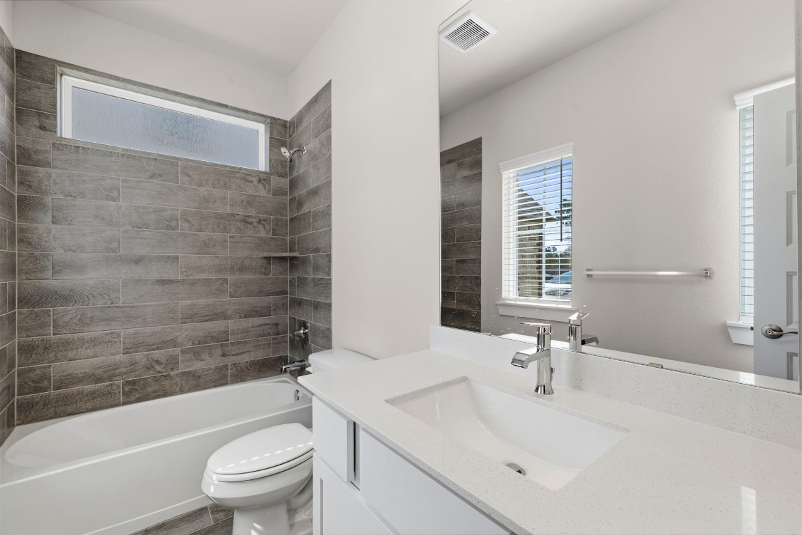 2137 Golden Spruce Court Conroe, TX 77301 - Photo 28 of 41 a bathroom with a sink a toilet and shower