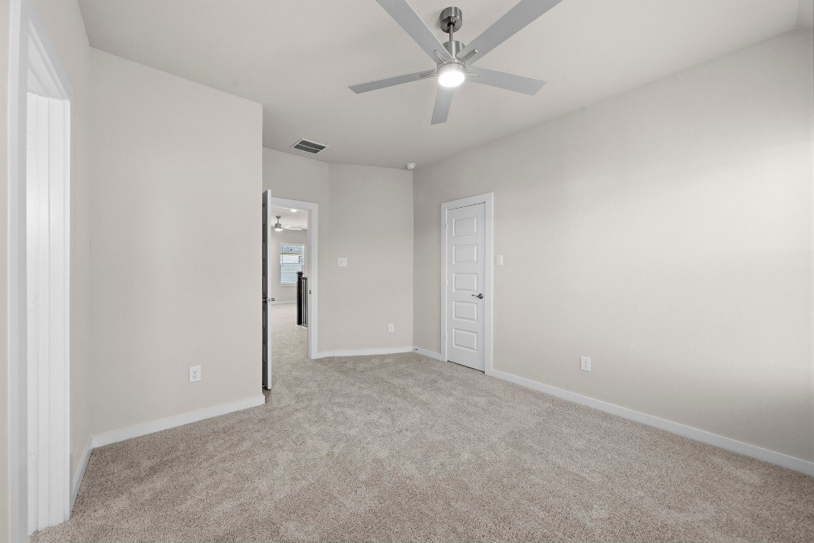 2137 Golden Spruce Court Conroe, TX 77301 - Photo 30 of 41 an empty room with a ceiling fan and a fan
