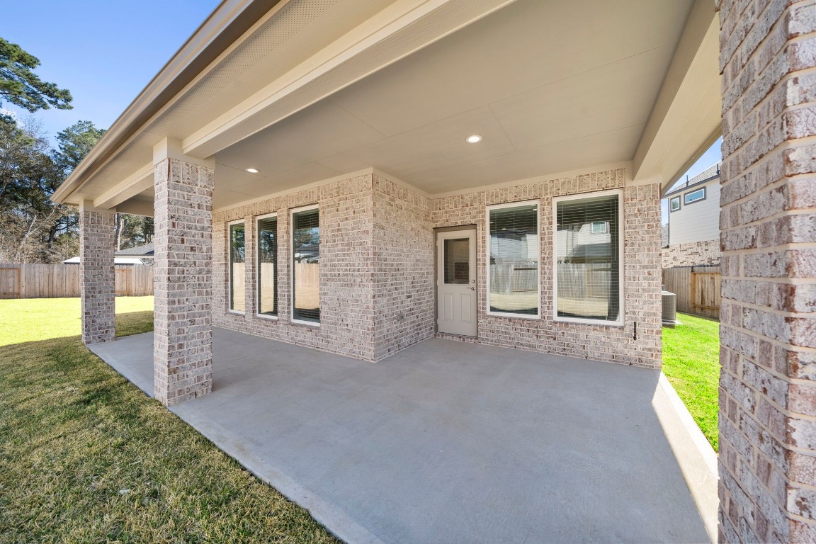 2137 Golden Spruce Court Conroe, TX 77301 - Photo 35 of 41 a view of a house with porch and garden