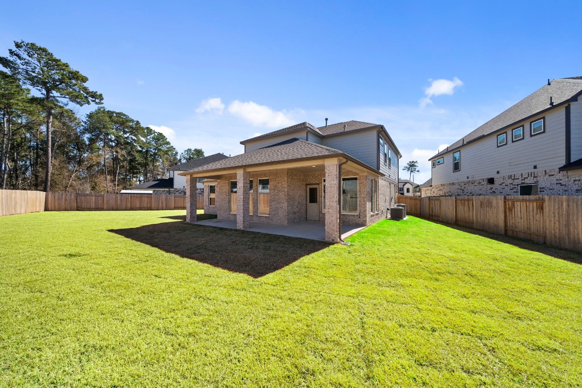 2137 Golden Spruce Court Conroe, TX 77301 - Photo 36 of 41 a view of outdoor space yard and swimming pool