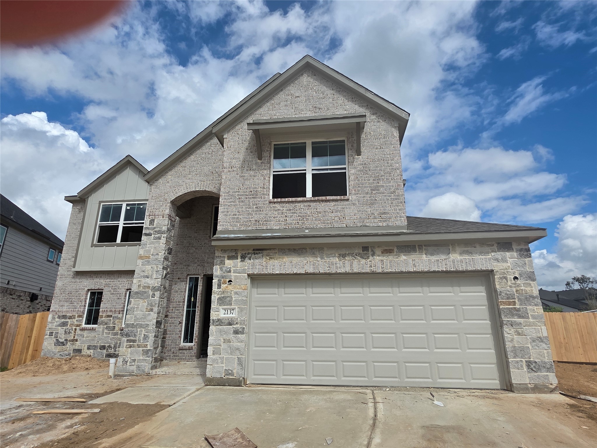2137 Golden Spruce Lane Conroe, TX 77301 - Photo 4 of 6 a front view of a house with garage