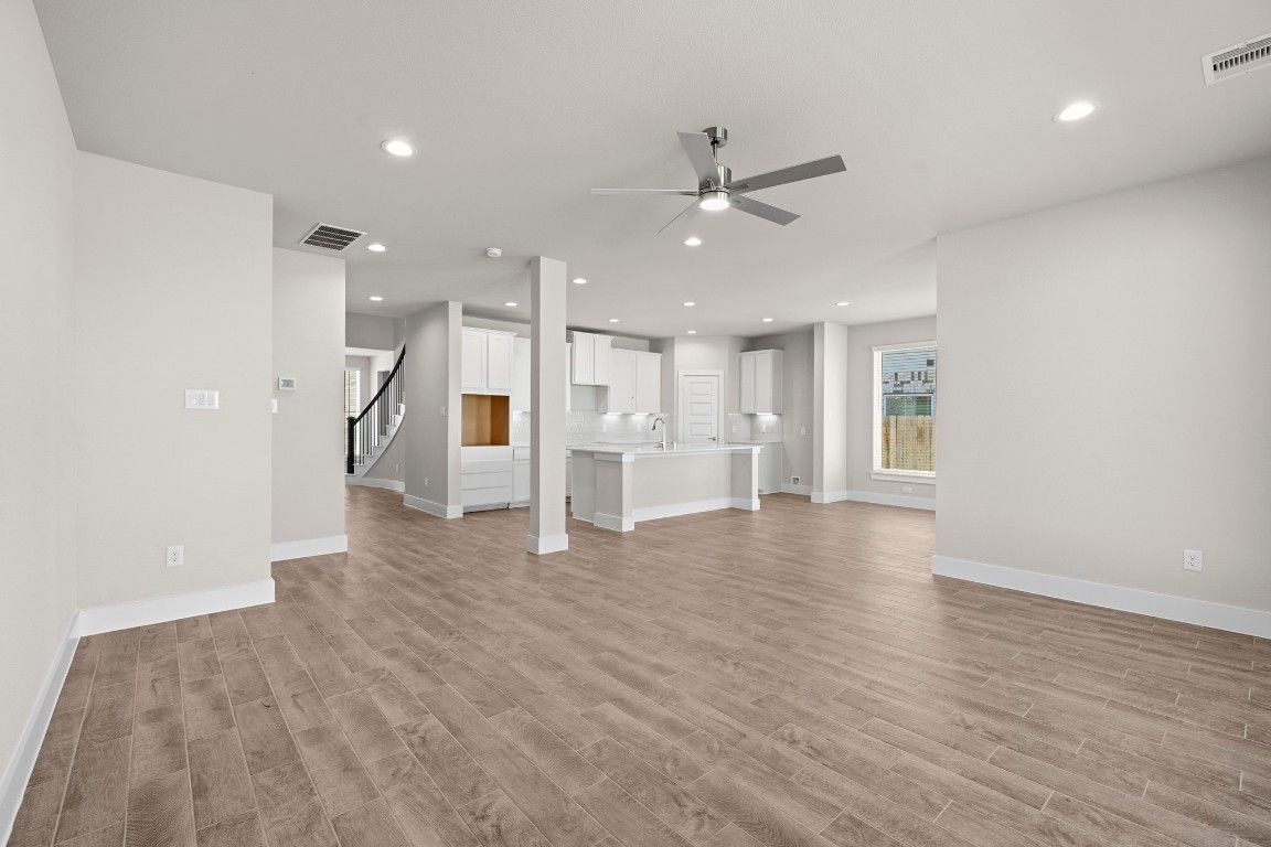 2137 Golden Spruce Court Conroe, TX 77301 - Photo 10 of 41 a view of an empty room with a window and wooden floor