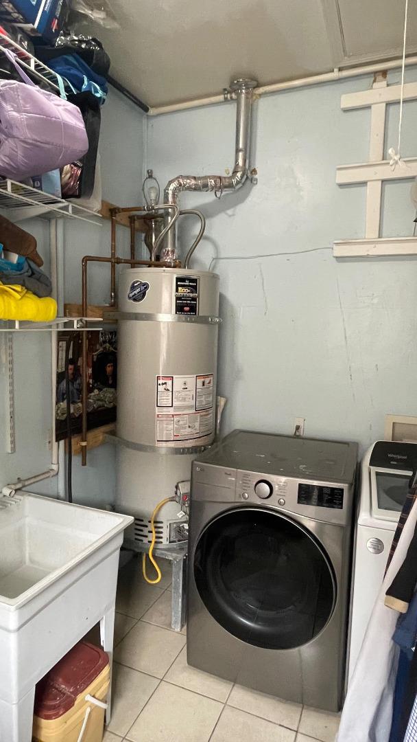 3223 Spring Street Redwood City, CA 94063 - Photo 11 of 14 a utility room with sink dryer and washer