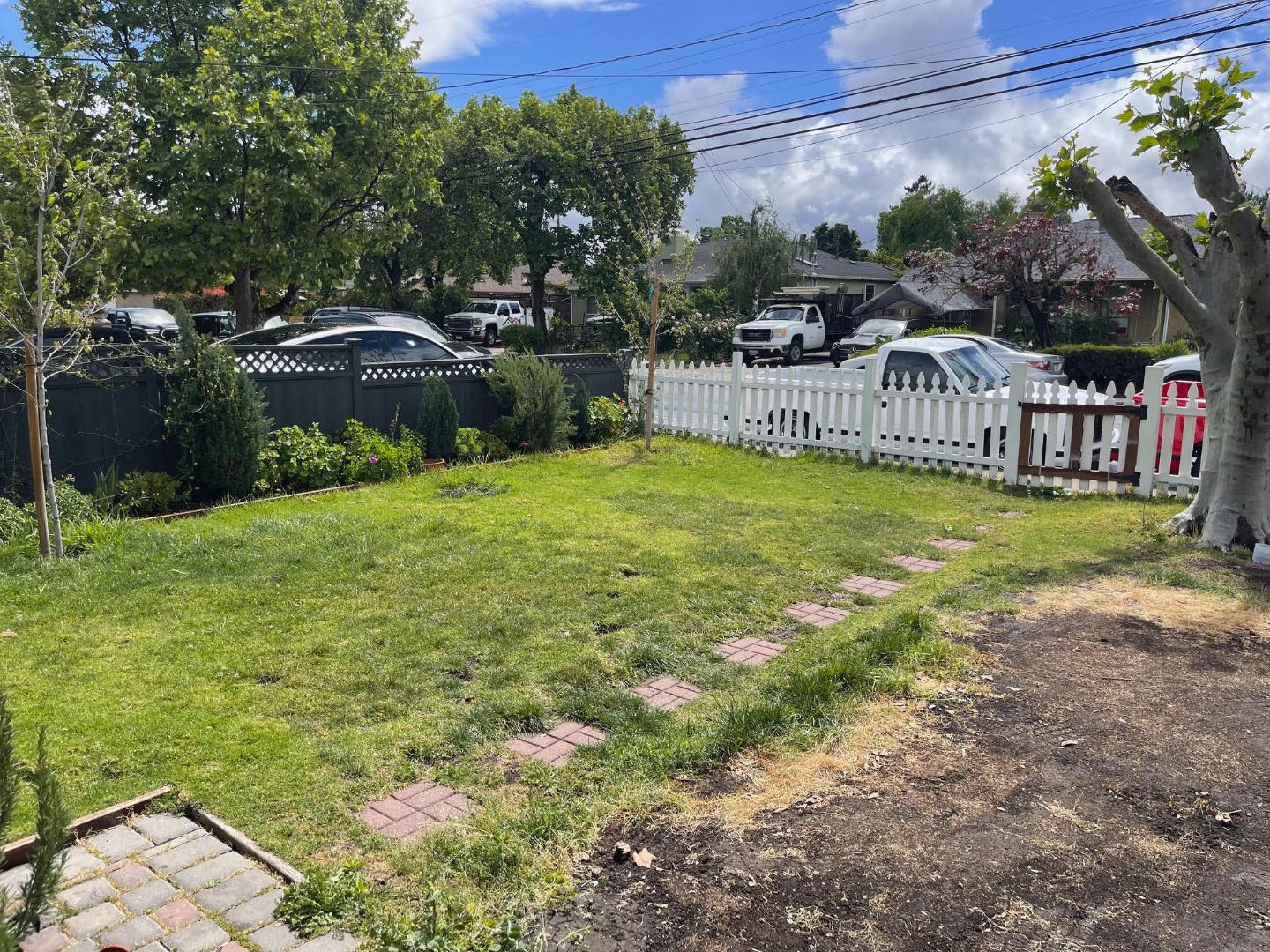 3223 Spring Street Redwood City, CA 94063 - Photo 14 of 14 a view of a house with a yard and sitting area