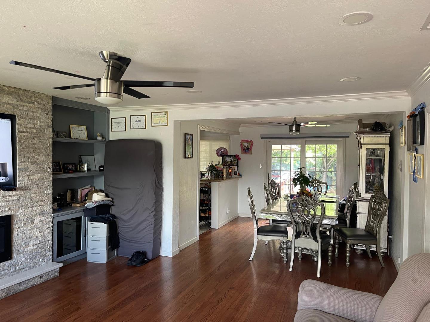 3223 Spring Street Redwood City, CA 94063 - Photo 5 of 14 a view of a dining room with furniture window and wooden floor