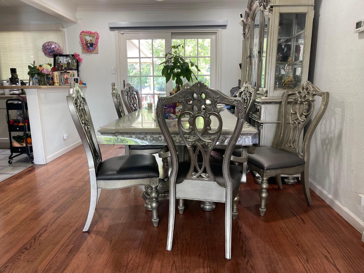 3223 Spring Street Redwood City, CA 94063 - Photo 6 of 14 a view of a dining room with furniture and wooden floor