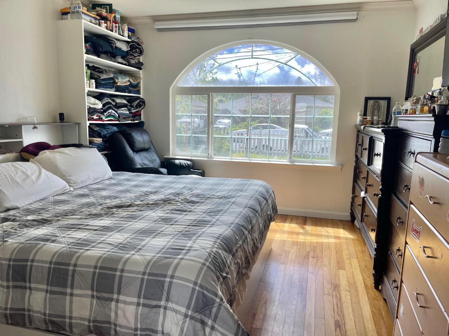 3223 Spring Street Redwood City, CA 94063 - Photo 8 of 14 a bedroom with a bed and a large window