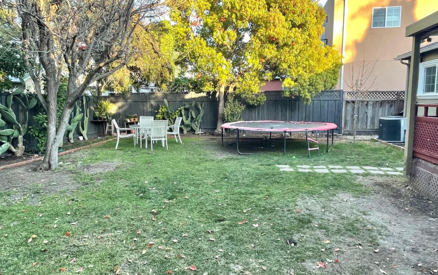 3223 Spring Street Redwood City, CA 94063 - Photo 9 of 10 a view of a chair and table in backyard of the house