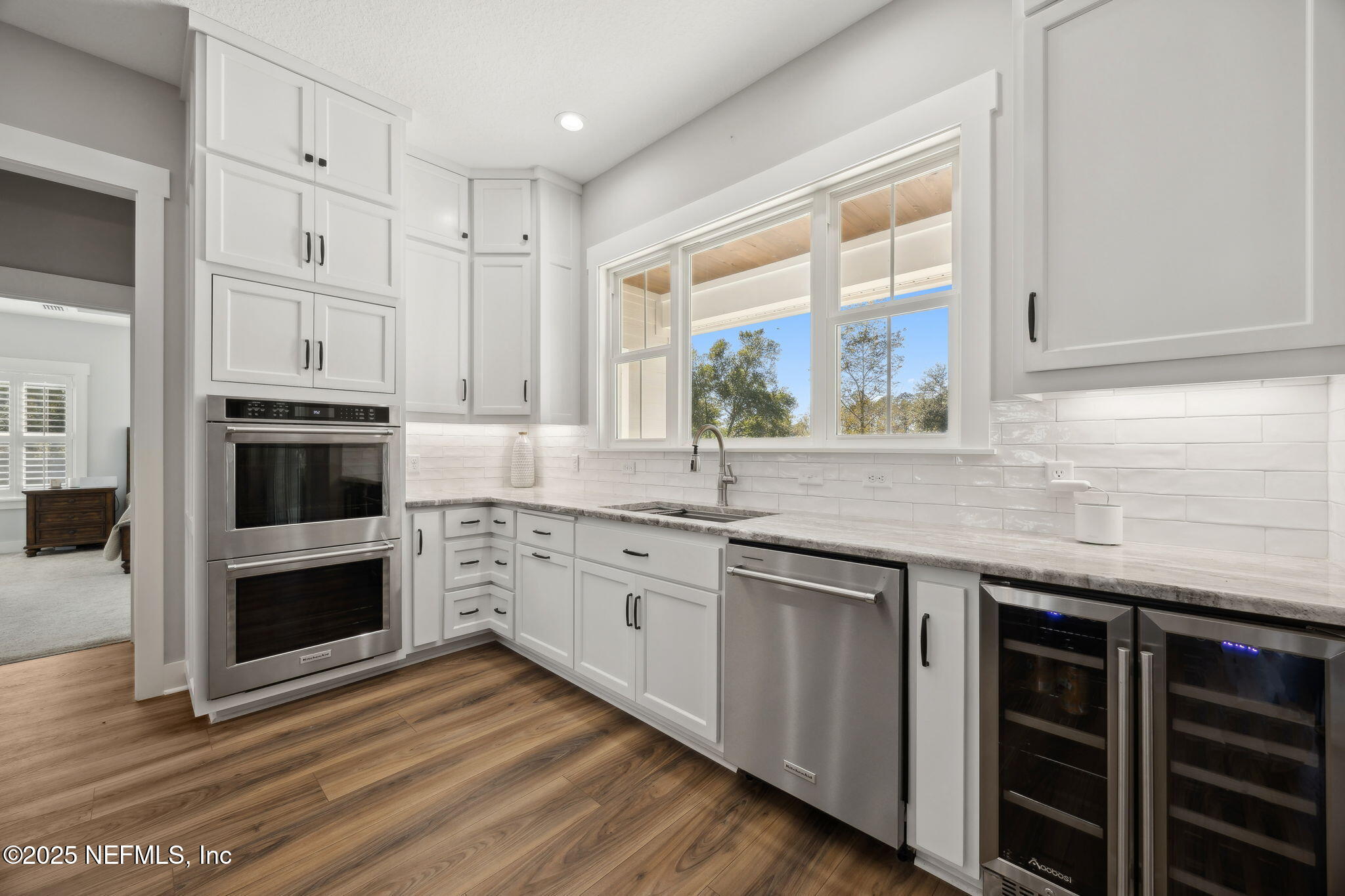 272272 Conner-Nelson Hilliard, FL 32046 - Photo 17 of 75 a kitchen with stainless steel appliances granite countertop a stove and a sink