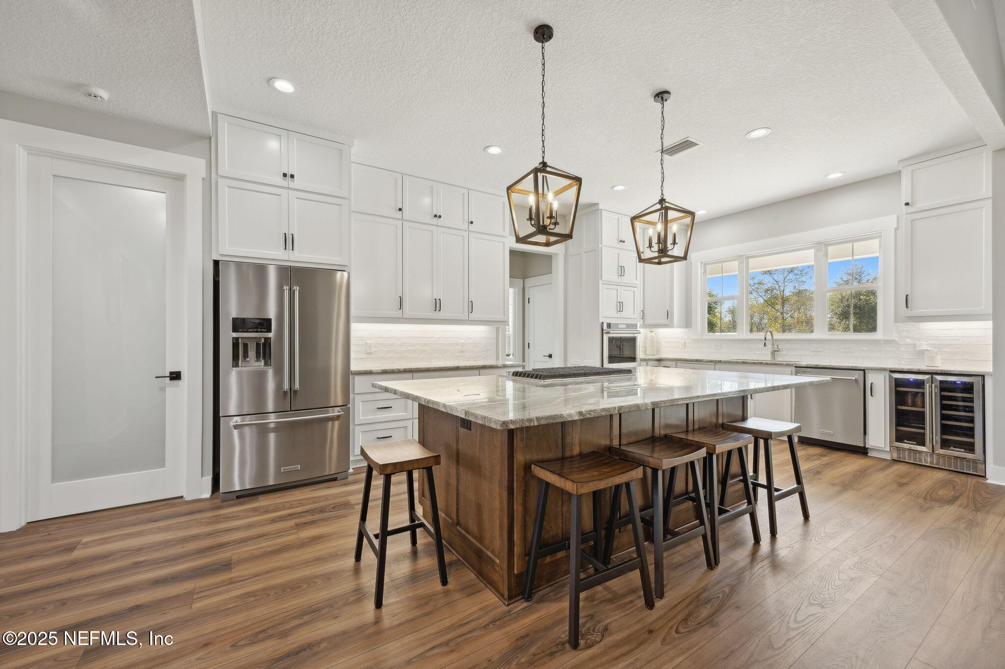 272272 Conner-Nelson Hilliard, FL 32046 - Photo 2 of 75 a kitchen with stainless steel appliances granite countertop a kitchen island hardwood floor and a sink