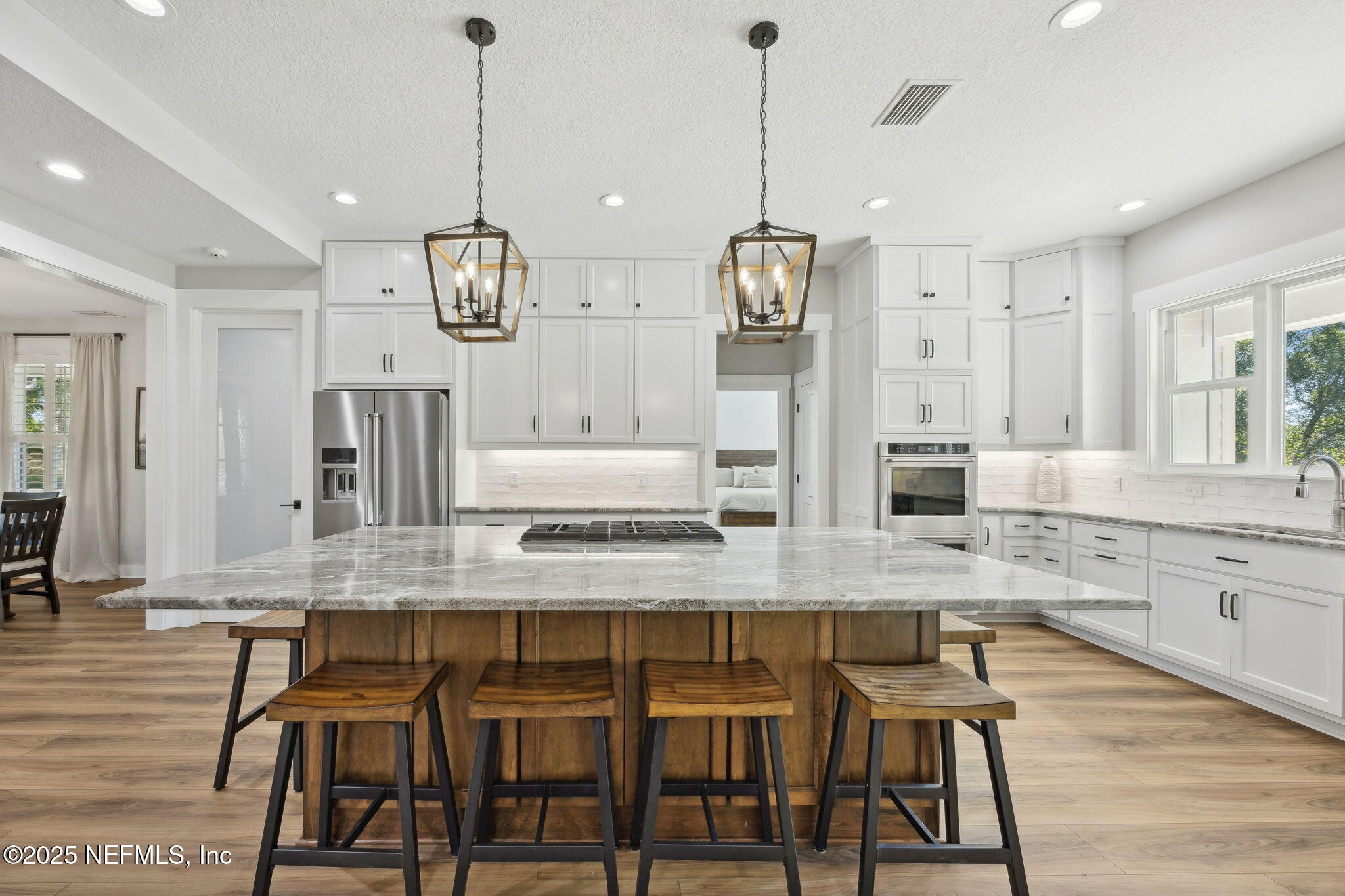 272272 Conner-Nelson Hilliard, FL 32046 - Photo 21 of 75 a large kitchen with granite countertop a counter space and stainless steel appliances