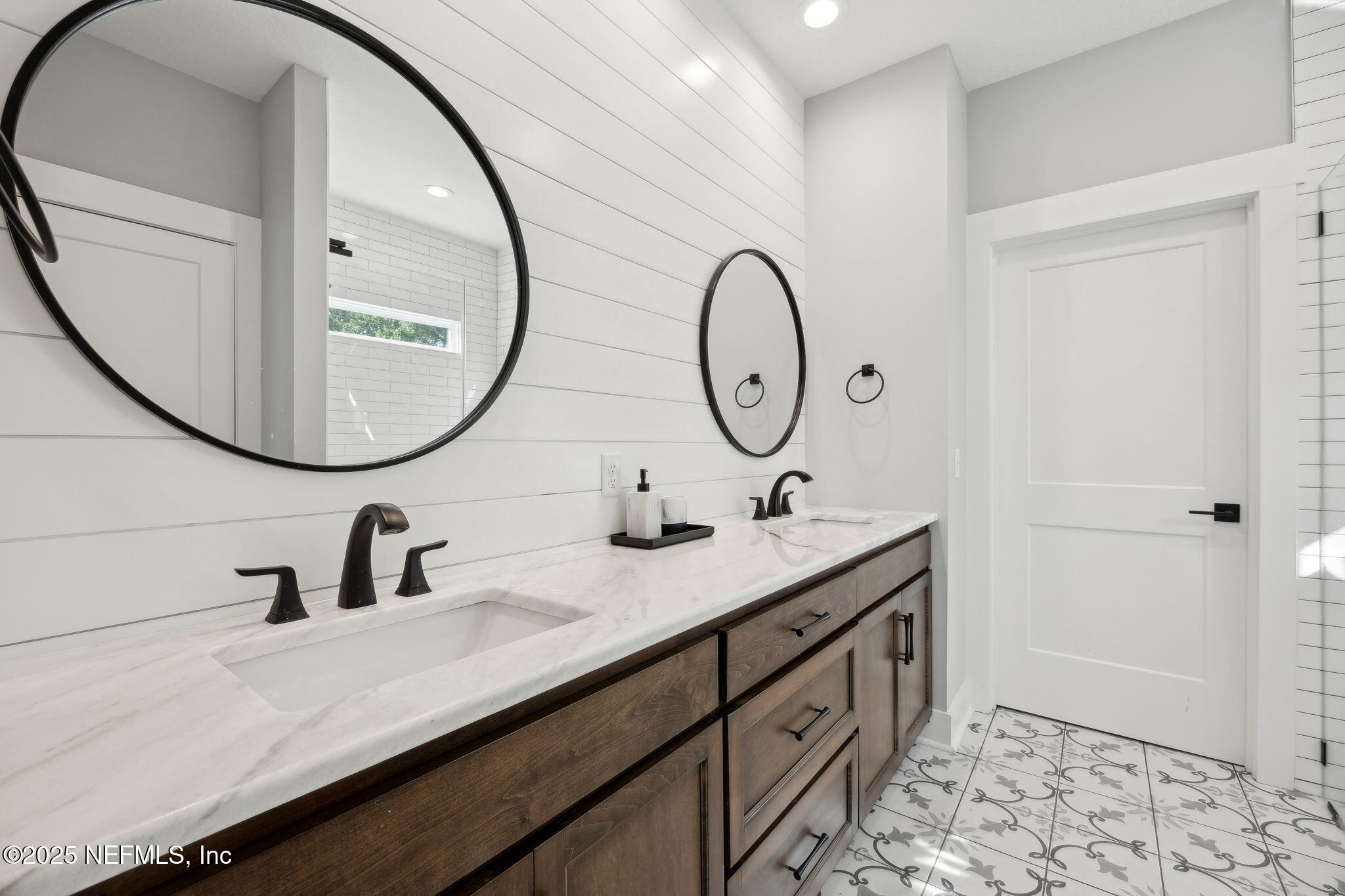 272272 Conner-Nelson Hilliard, FL 32046 - Photo 29 of 75 a bathroom with a double vanity sink and a mirror