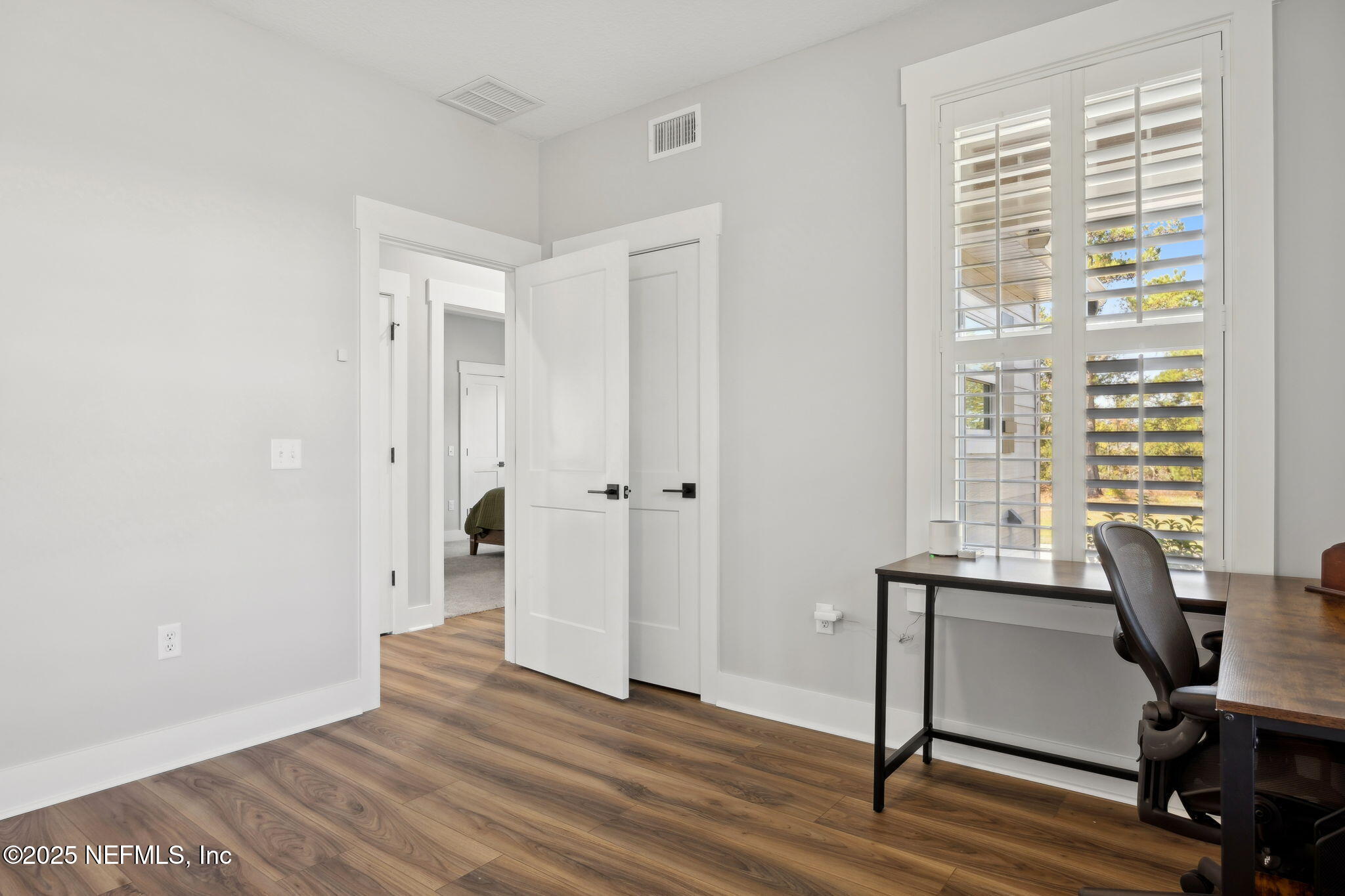 272272 Conner-Nelson Hilliard, FL 32046 - Photo 32 of 75 a view of a workspace with wooden floor and a window