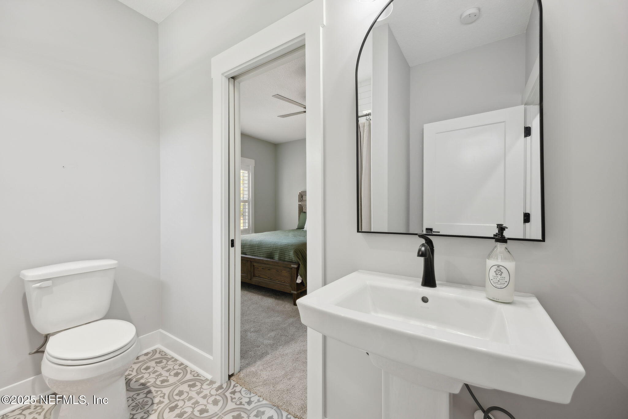 272272 Conner-Nelson Hilliard, FL 32046 - Photo 36 of 75 a bathroom with a toilet sink and mirror