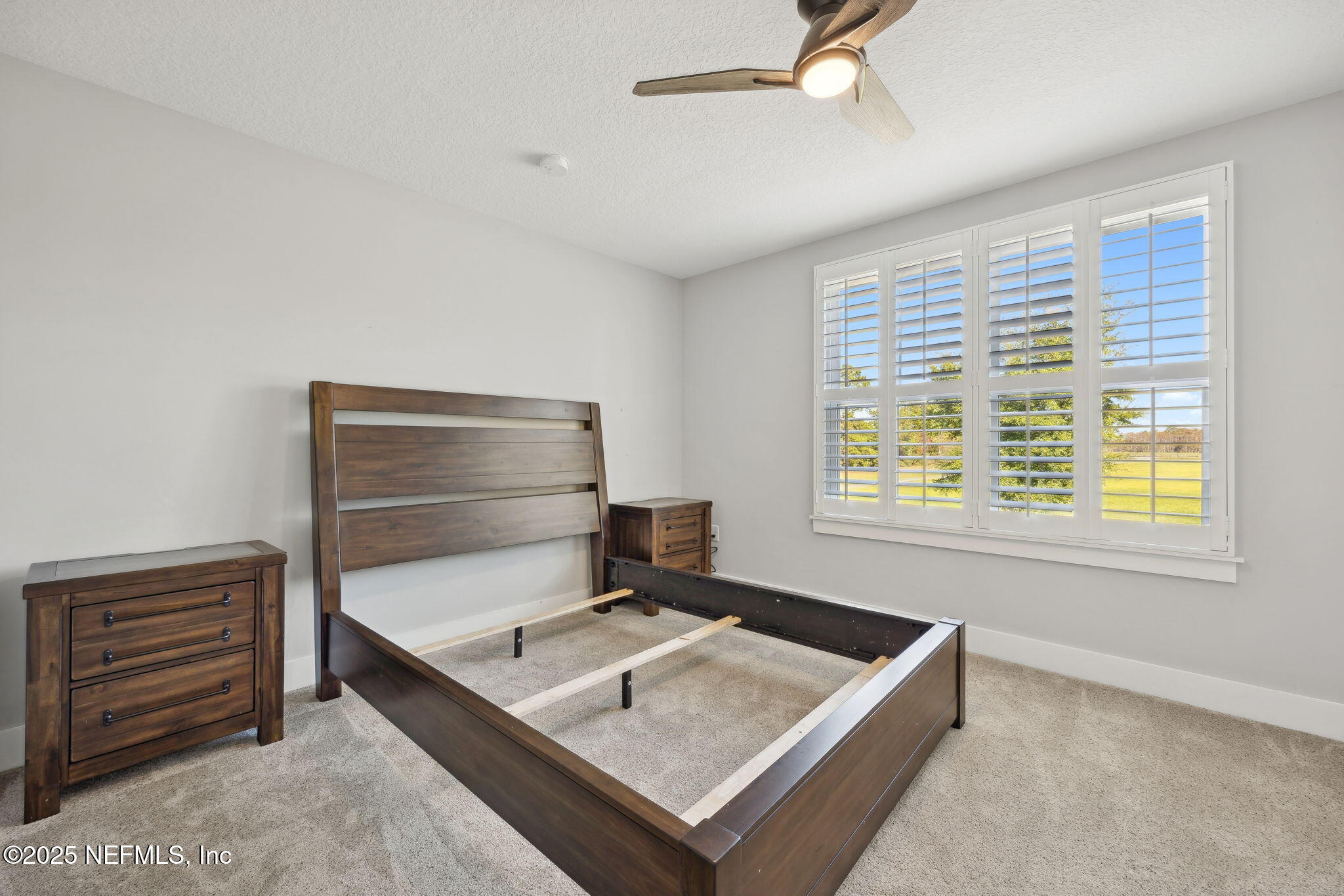 272272 Conner-Nelson Hilliard, FL 32046 - Photo 37 of 75 a living room with a bed furniture and a window
