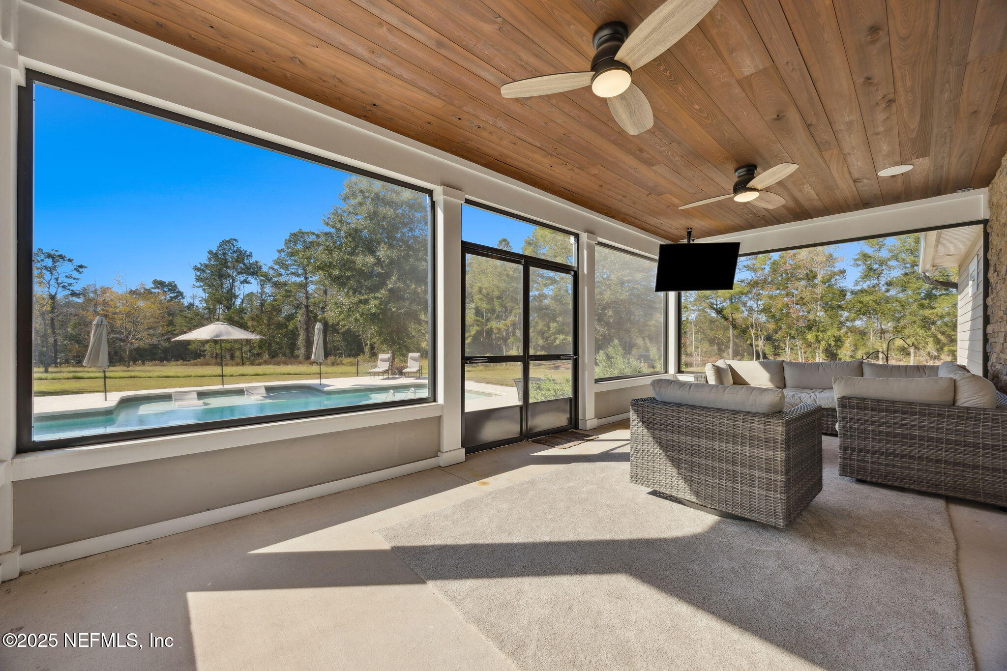 272272 Conner-Nelson Hilliard, FL 32046 - Photo 4 of 75 a living room with furniture and large windows