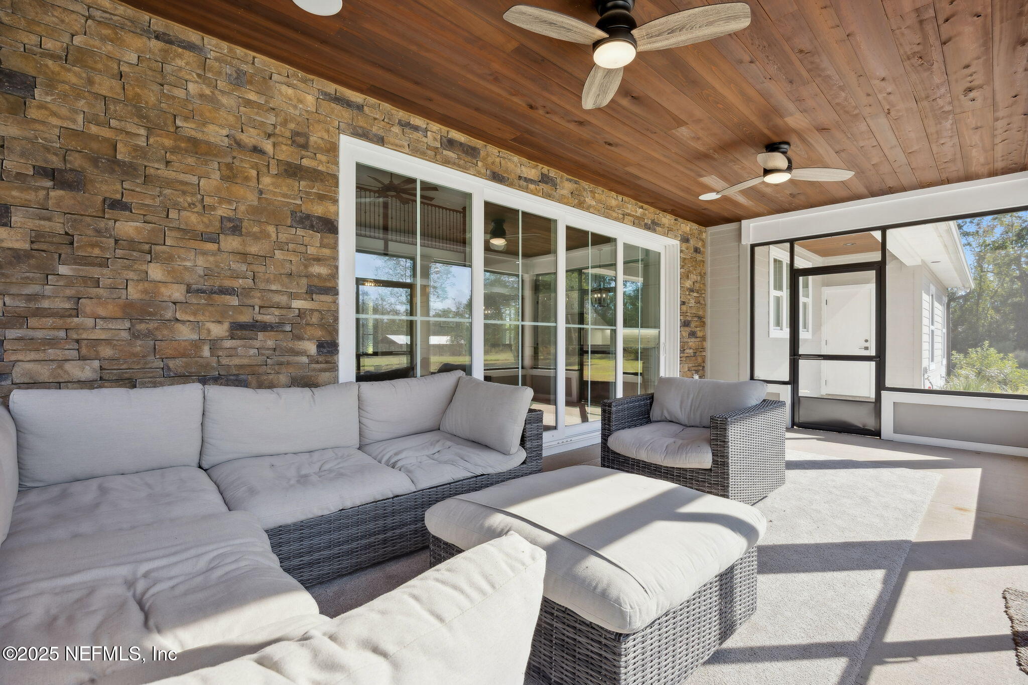 272272 Conner-Nelson Hilliard, FL 32046 - Photo 47 of 75 a living room with furniture and a large window
