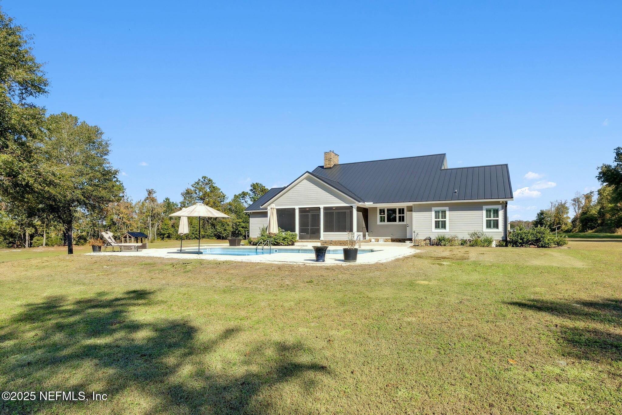 272272 Conner-Nelson Hilliard, FL 32046 - Photo 50 of 75 a front view of a house with a big yard