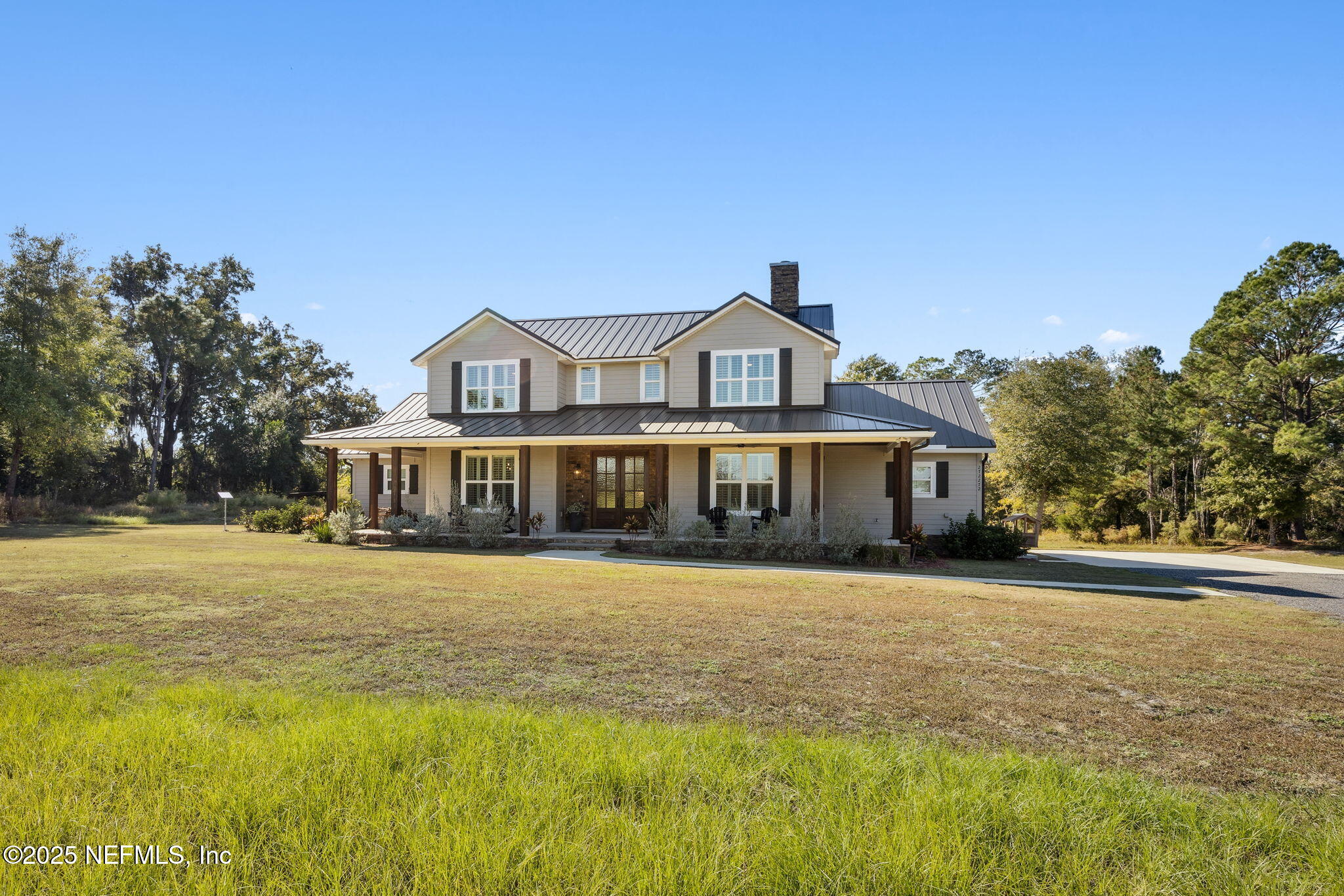 272272 Conner-Nelson Hilliard, FL 32046 - Photo 9 of 75 a front view of a house with a yard
