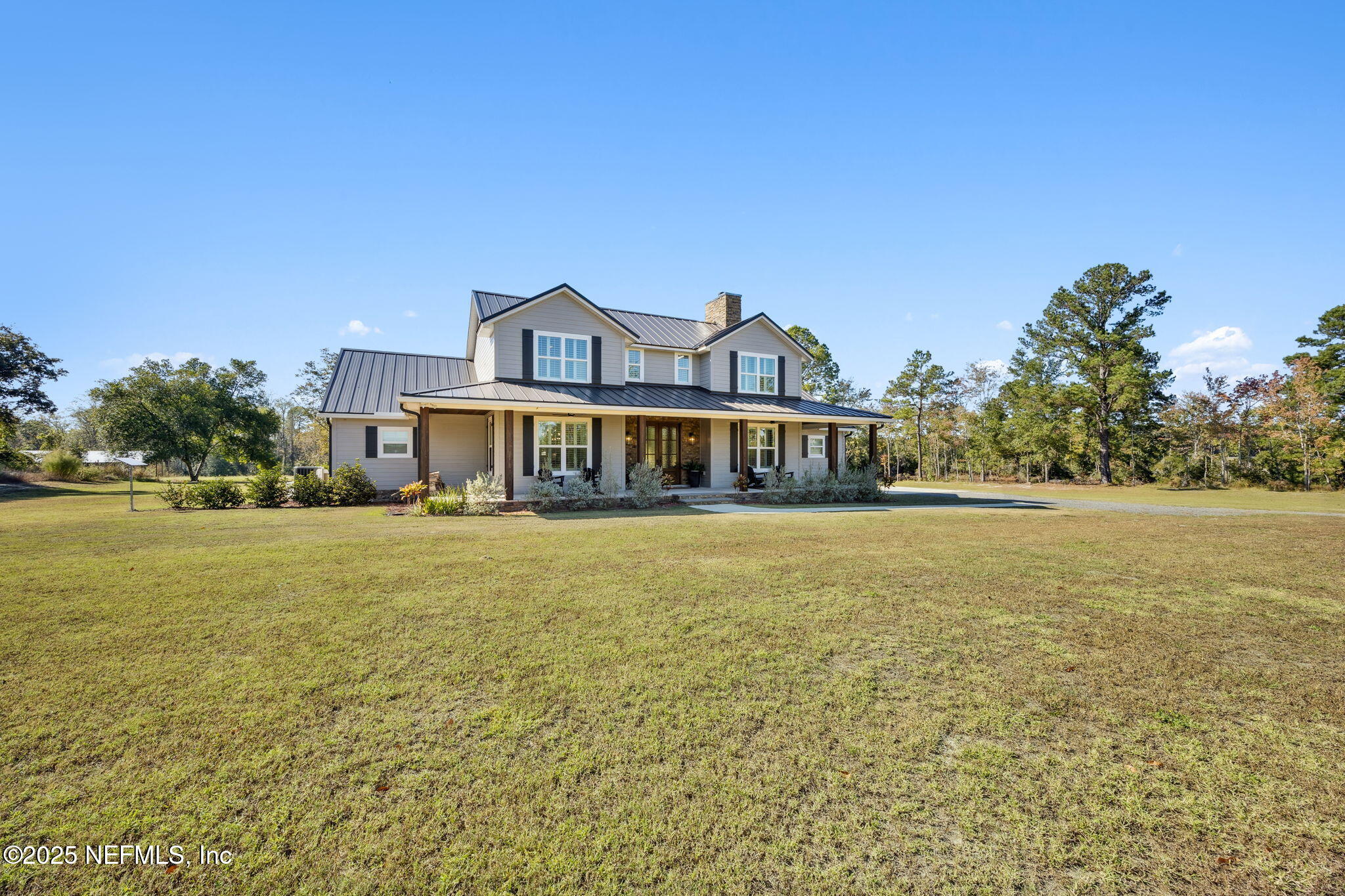 272272 Conner-Nelson Hilliard, FL 32046 - Photo 10 of 75 a front view of a house with a big yard