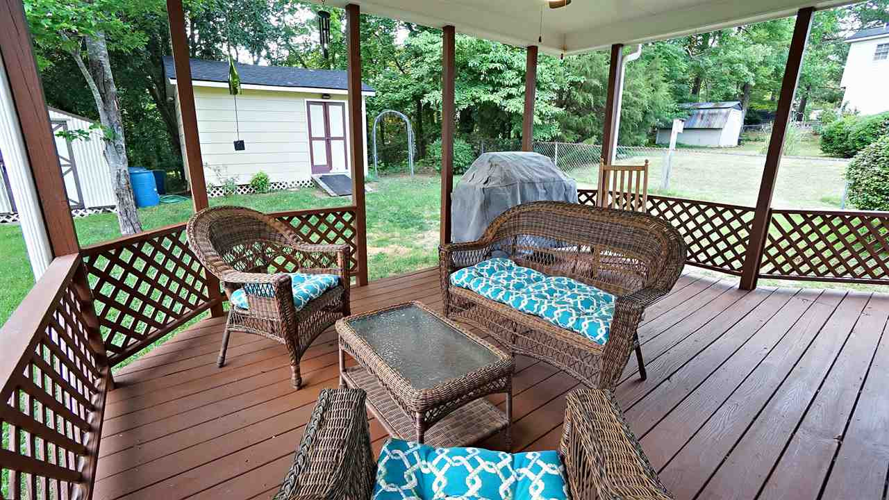 6609 Keystone Drive Raleigh, NC 27612 - Photo 9 of 25 Relax on the oversized covered back deck and enjoy the partially fenced back yard! Exterior Back