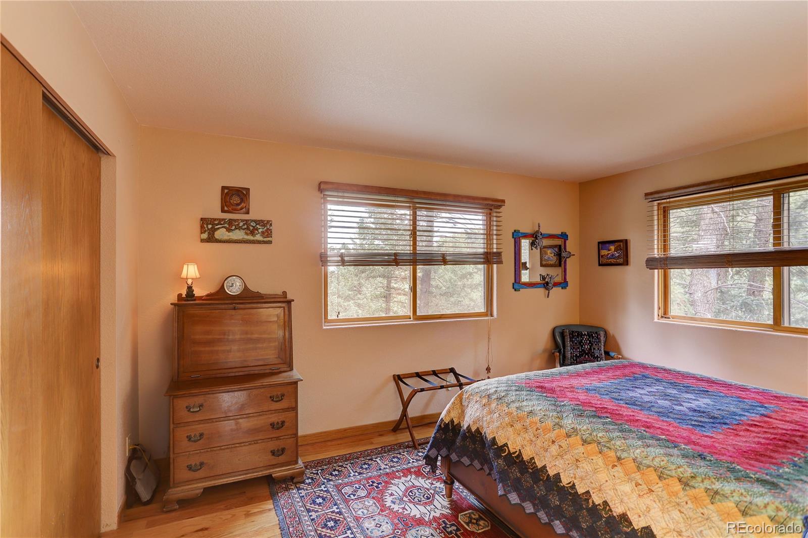 23072 Pinecrest Road Golden, CO 80401 - Photo 24 of 34 a bedroom with a bed and a window