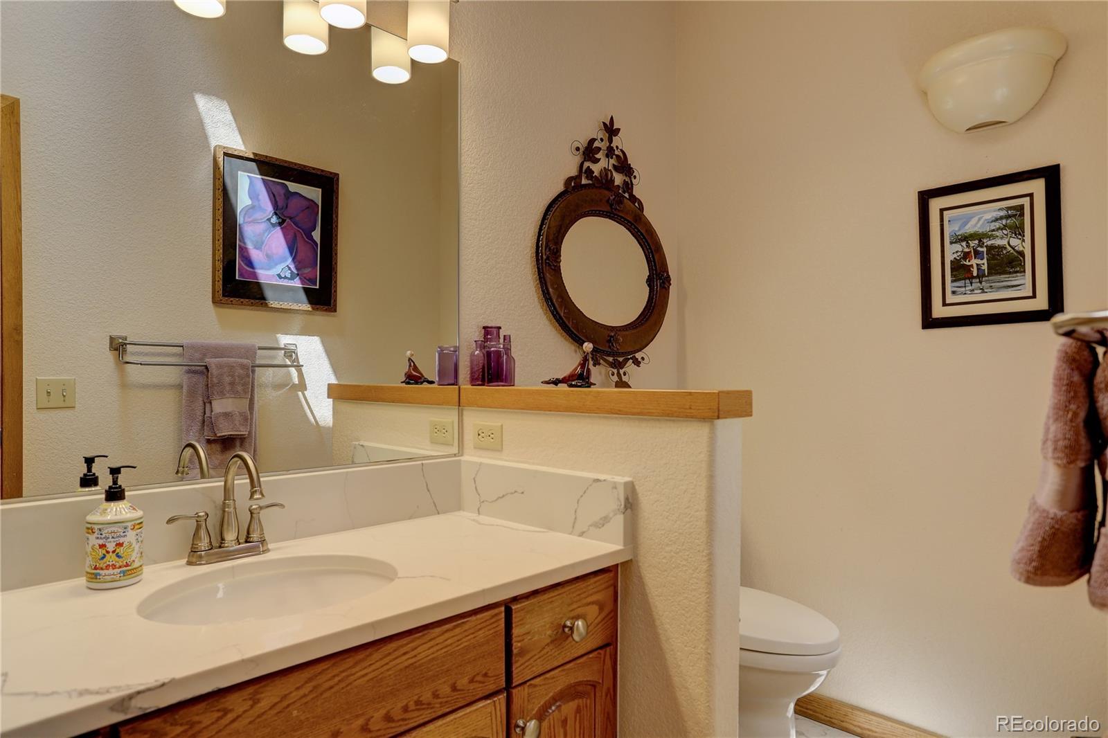 23072 Pinecrest Road Golden, CO 80401 - Photo 25 of 34 a bathroom with a sink and a toilet