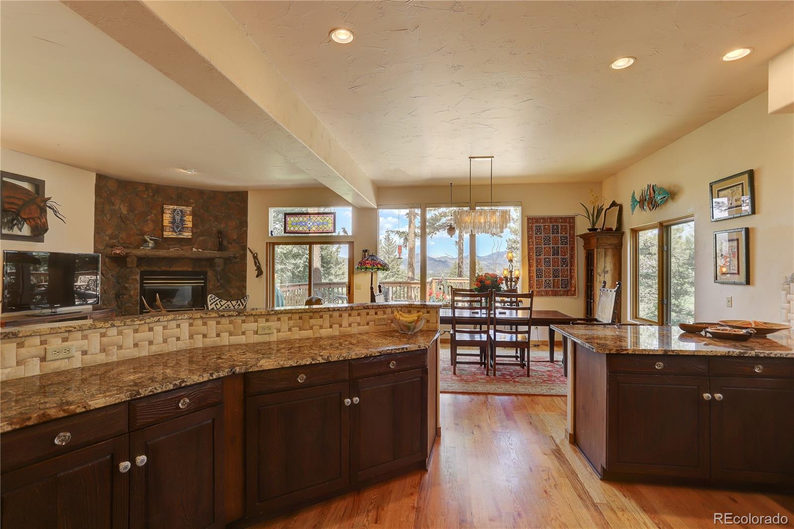 23072 Pinecrest Road Golden, CO 80401 - Photo 8 of 34 a kitchen with lots of counter top space and living room
