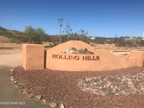a view of a ocean with a building in the background