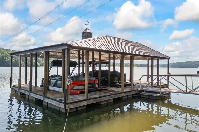 a view of house with swimming pool in front of it