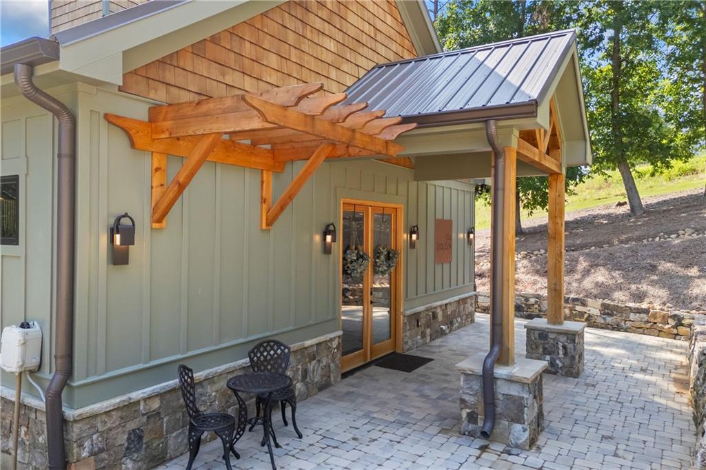 1132 Edgewater Trail Toccoa, GA 30577 - Photo 15 of 51 a backyard of a house with barbeque oven table and chairs