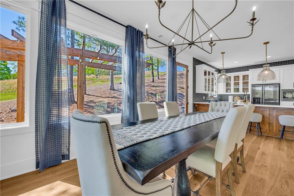 1132 Edgewater Trail Toccoa, GA 30577 - Photo 30 of 51 a dining room with stainless steel appliances granite countertop a couch and wooden floor