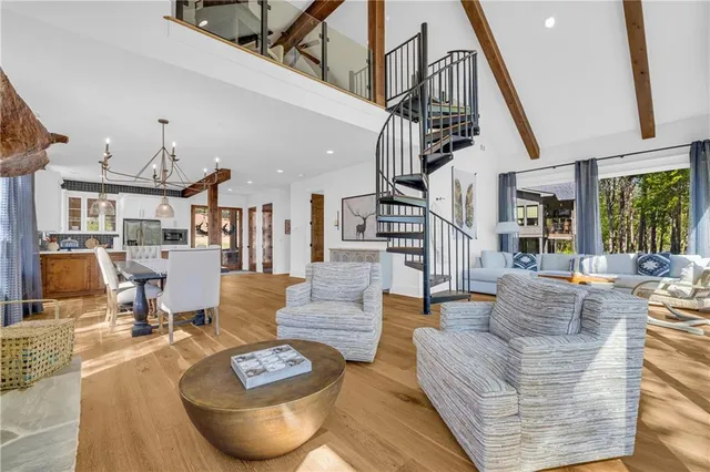 a living room with furniture and large windows