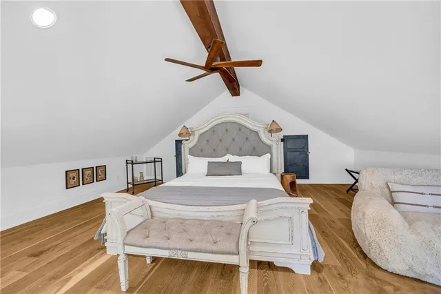 a bedroom with a bed a desk and chair