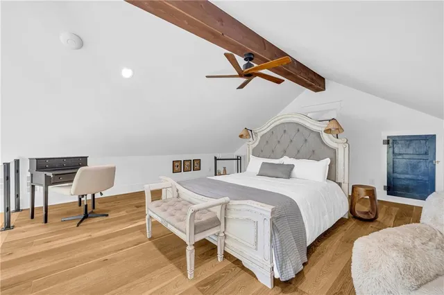 a bed room with a bed and a table