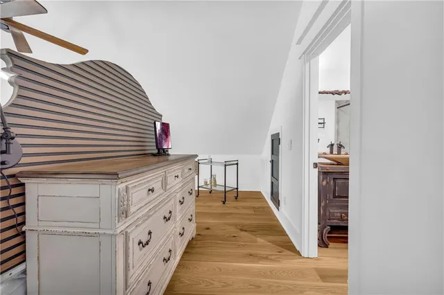 a view of bathroom with a sink and mirror