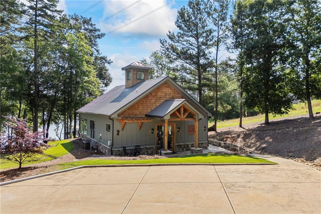 1132 Edgewater Trail Toccoa, GA 30577 - Photo 6 of 51 a house view with a swimming pool and of trees