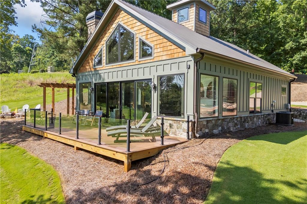 1132 Edgewater Trail Toccoa, GA 30577 - Photo 7 of 51 a view of house with backyard and outdoor seating